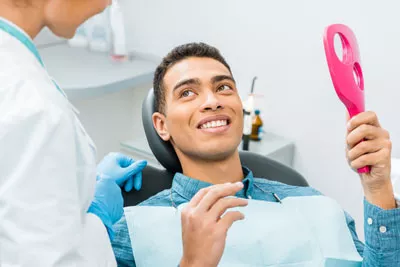 patient smiling after a cosmetic dentistry procedure in Chatsworth, CA
