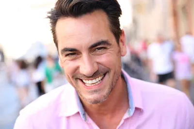 man smiling after getting dental veneers from Chatsworth Dental Group