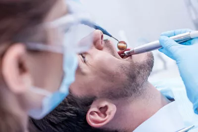 patient receiving a checkup after a root canal at Chatsworth Dental Group